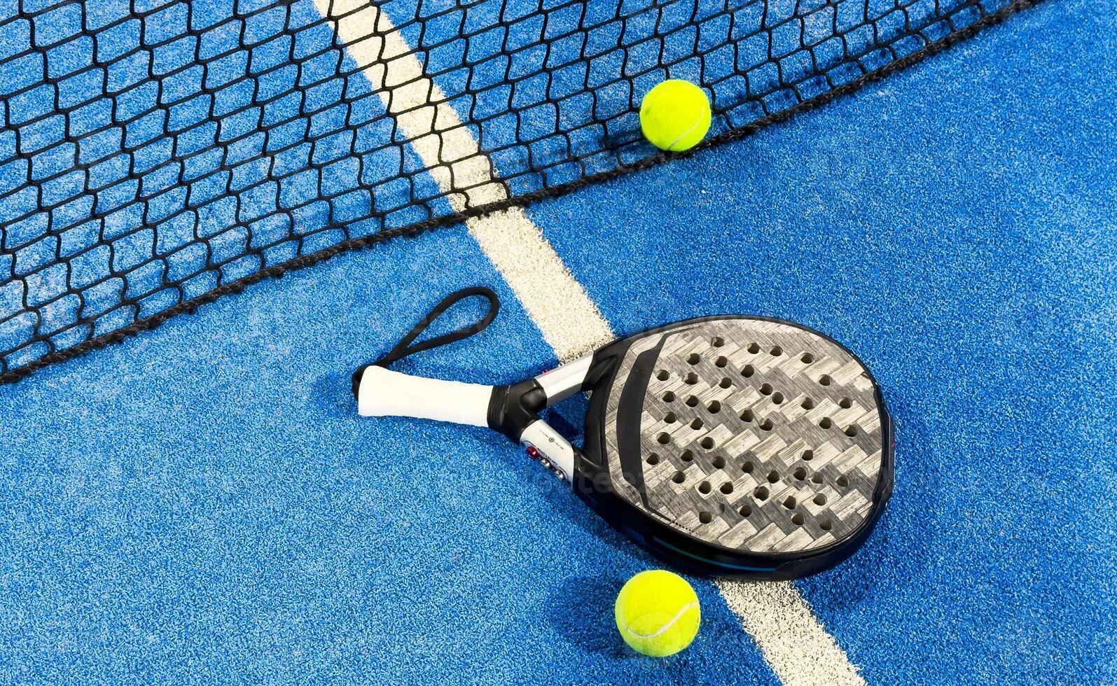 paddle-racket-with-a-ball-ready-to-play-the-fastest-growing-sport-in-recent-years-worldwide-padel-court-in-summer-the-perfect-time-to-practice-this-sporting-discipline-and-release-stress-photo